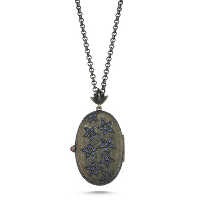 Deep Blue Dove Locket. 18K Yellow Gold and oxidized silver with 0,40ct diamonds, 15.01ct blue sapphires, 0,30ct rubies. Chain: Oxidised silver